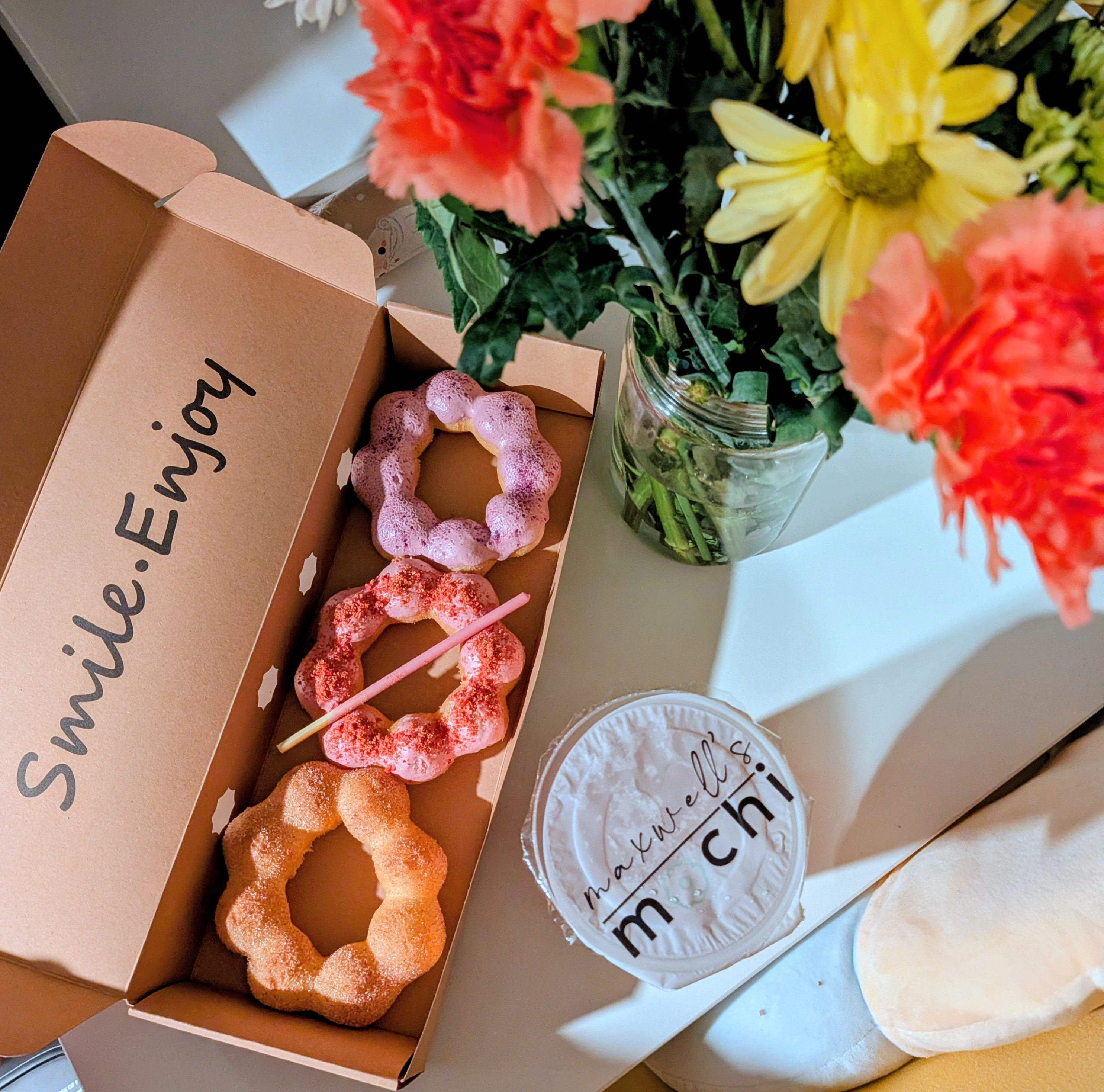 Mochi doughnuts, drink, and flowers